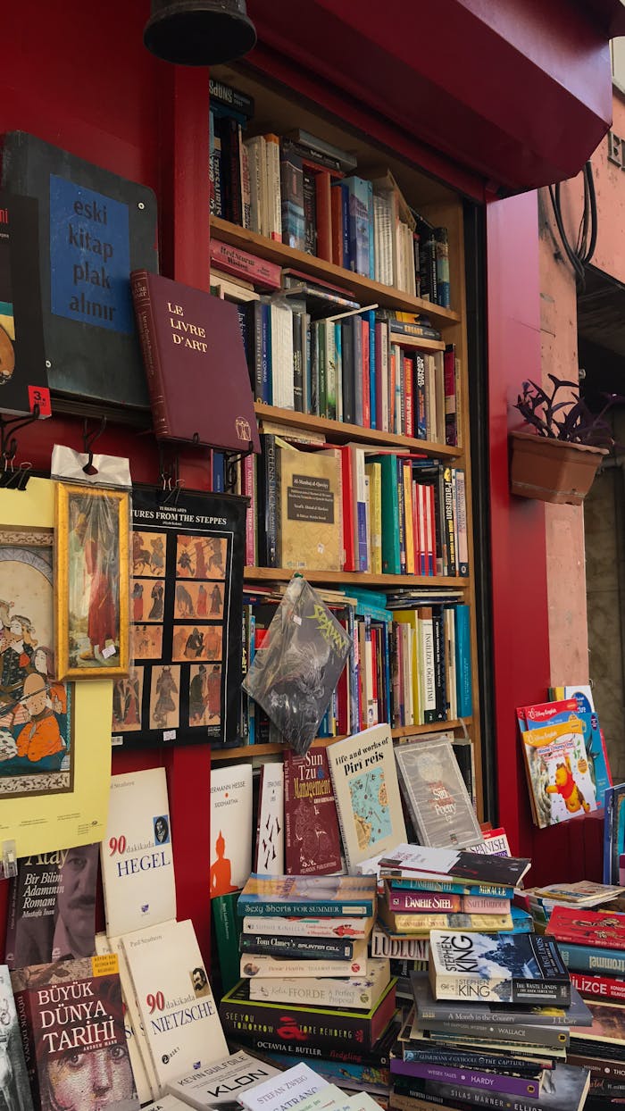 A vibrant display of books stacked outside a bookstore, showcasing a rich assortment of literature.